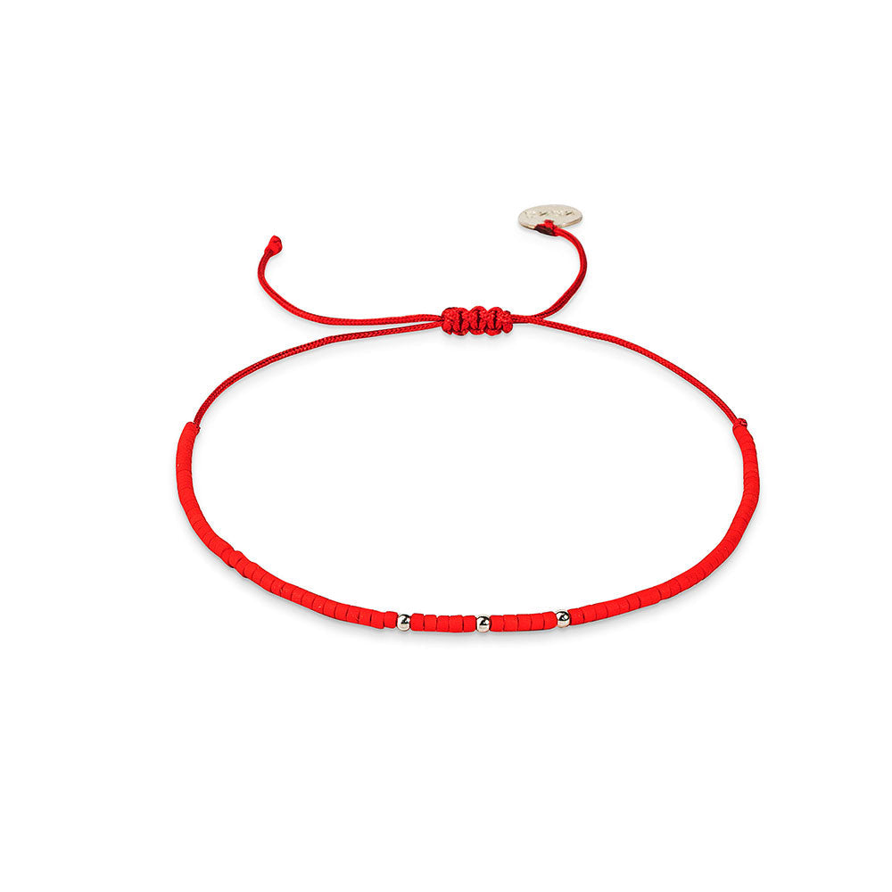 Pulsera roja con mostacillas de plata